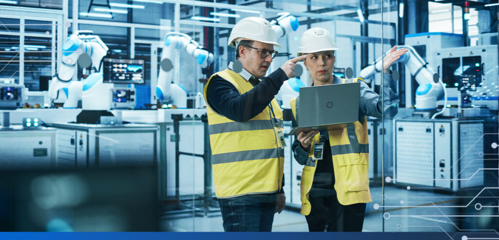 Manufacturing workers using Dynamics 365 ERP system to streamline their workflow.